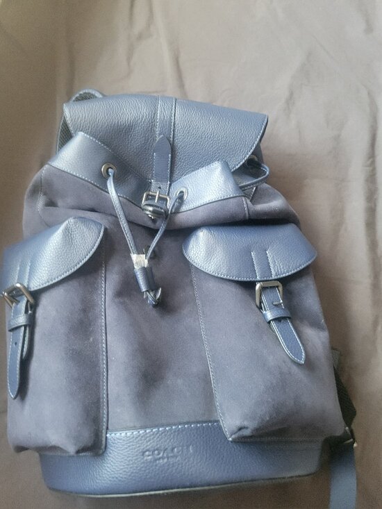 coach backpack blue leather 1990s Daypack in Powder Signature coated canvas and smooth leather Inside zip cell phone and multifunction pockets Laptop compartment with zip closure Zip closure recycled polyester lining Top handle with 3 drop Outside zip pocket Luggage sleeve Adjustable shoulder straps Fits a 16 laptop 11 3/4 (L) x 16 1/2 (H) x 6 (W) Style No. Coach Light Blue Pebble Leather